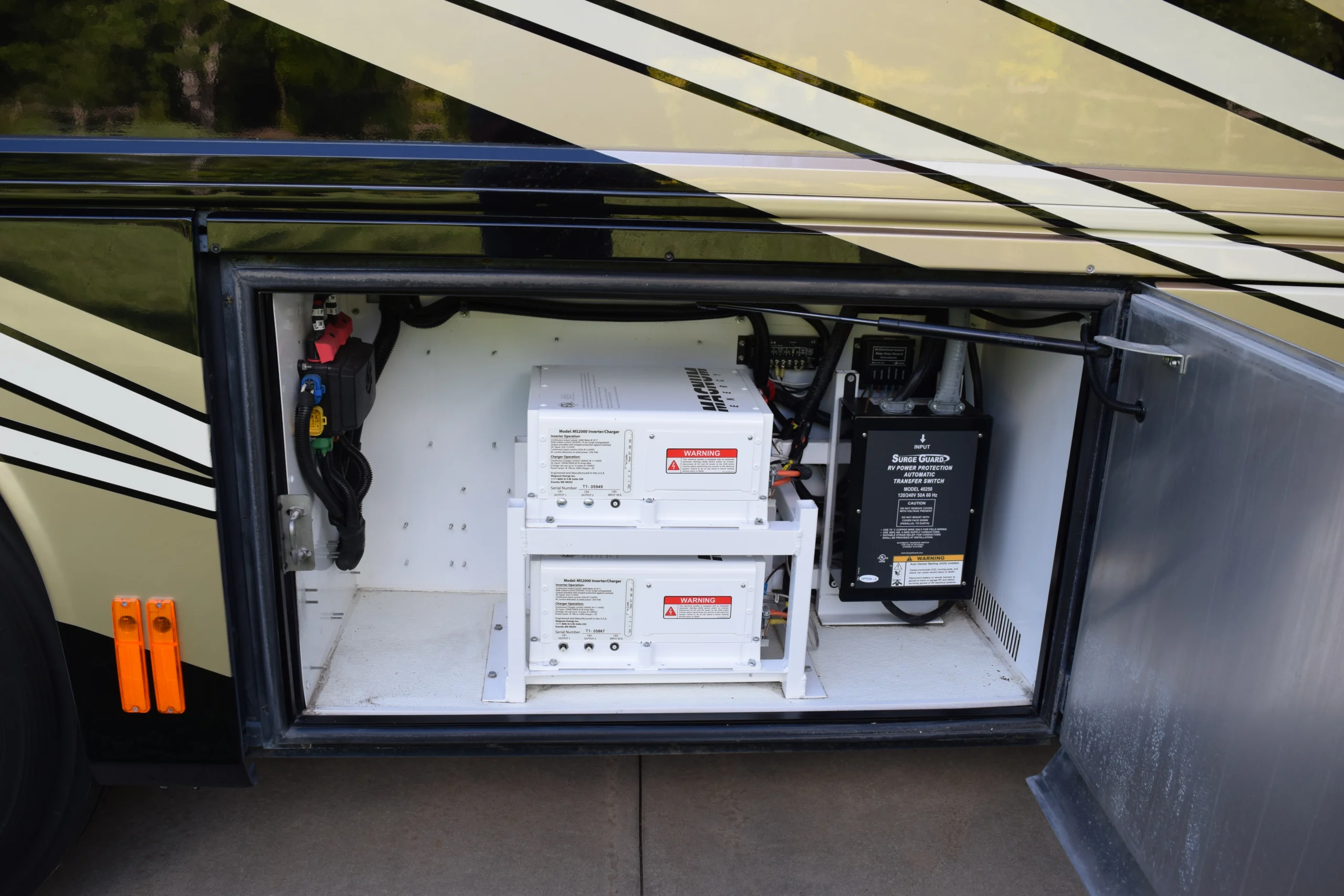 DSC_0352 Open compartment on a Motorcoach showing electrical wiring, components, and surge protection equipment.