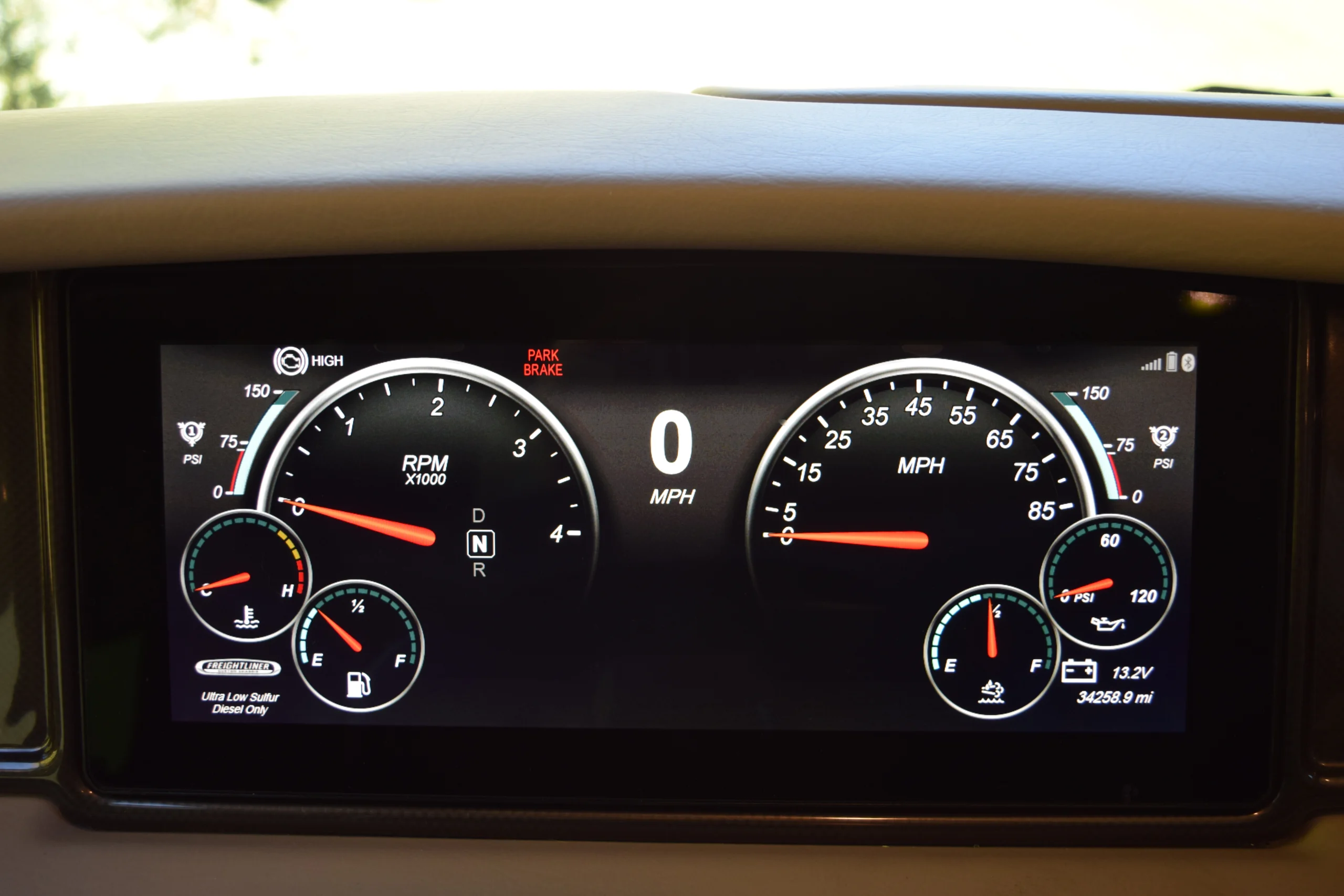 DSC_0713 Dashboard of a motorcoach displaying RPM, speed, fuel, temperature, and pressure gauges, with odometer reading 34,258.9 miles.